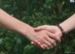 Photo of friends holding hands