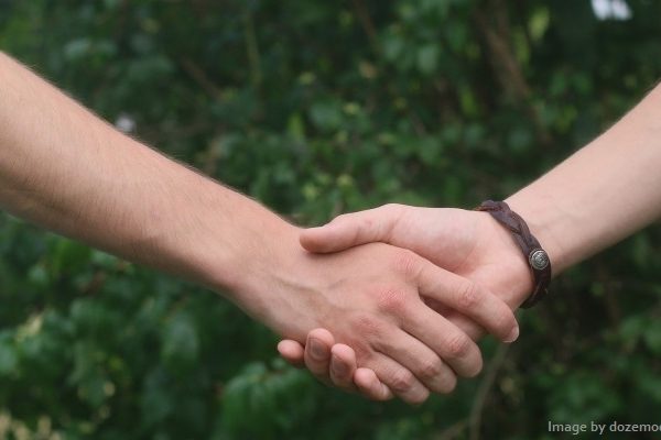 Photo of friends holding hands