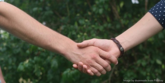 Photo of friends holding hands